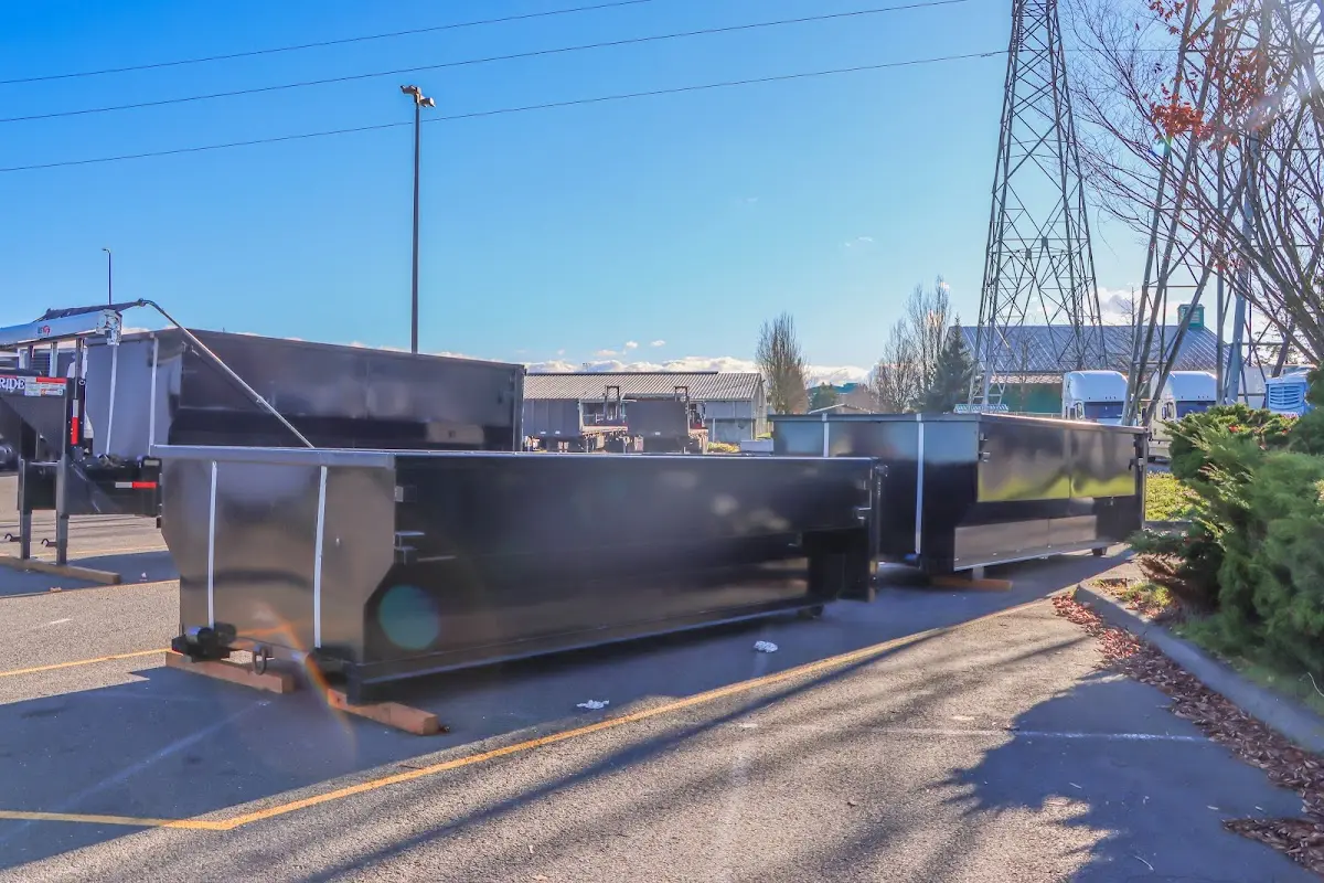 Roll-off dumpster ready for waste disposal at job site for 2 Yard Dumpster Rental in Lyndhurst